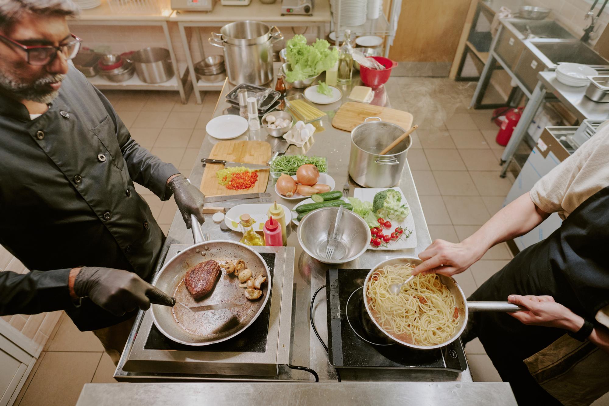 Open kitchen with plated food and service team